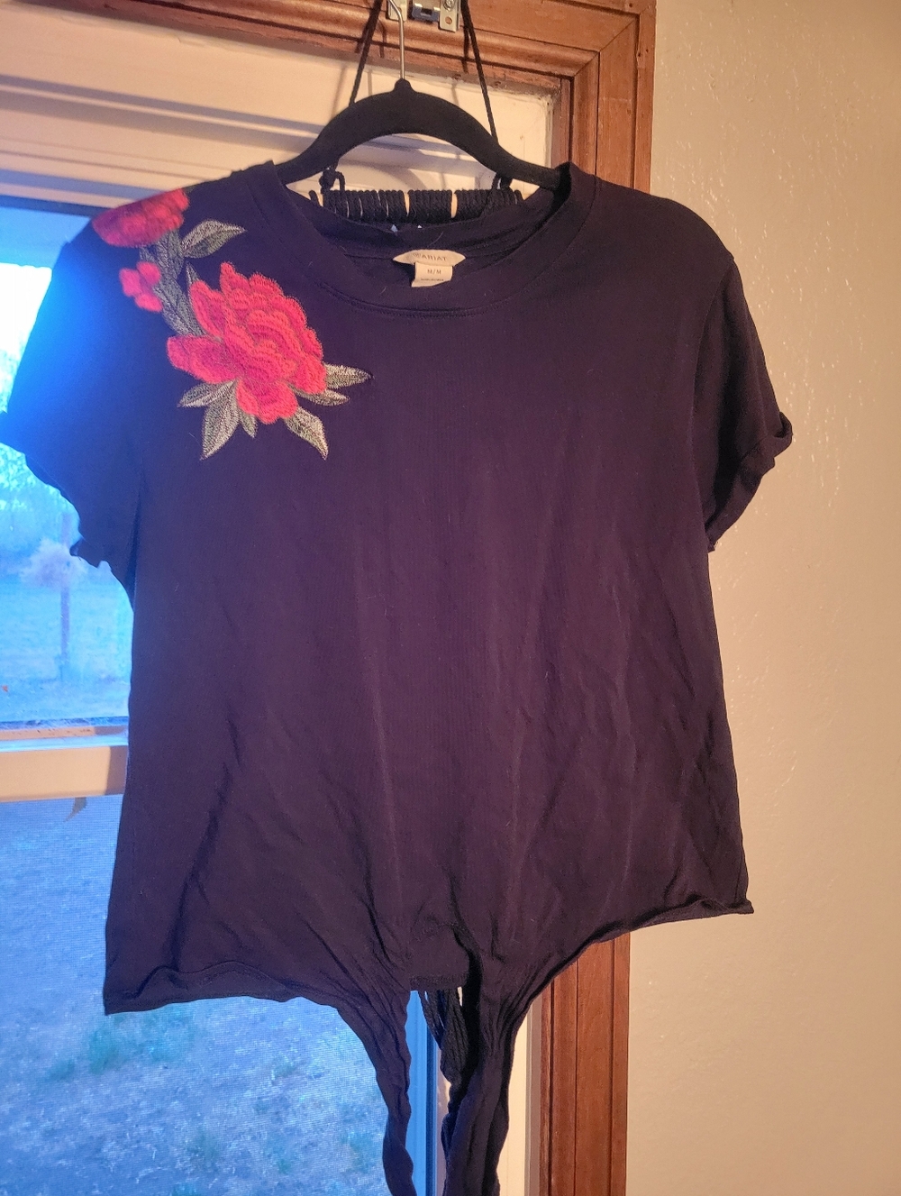 Ariat - Medium tie in front shirt. The shirt is black with red rose embrodery.